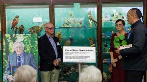 Barry Upson, Chancellor Cecilia Tarrant and Kaiarataki Michael Steedman at the renaming of the Biology Building, with George Mason portrait.