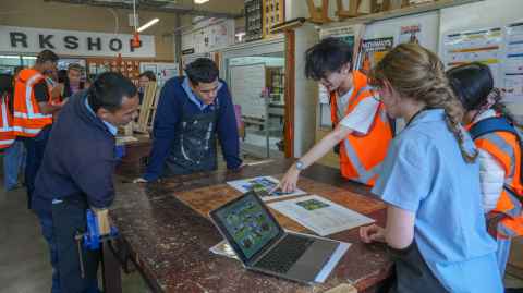 Design Programme and Trade Academy students discuss potential improvements.