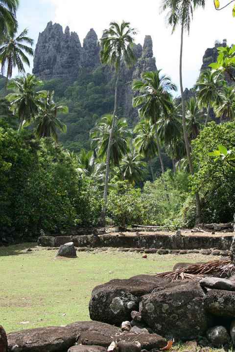 A mountainous tropical island scene with ancient rocks in the foreground. Photo: Melinda Allen