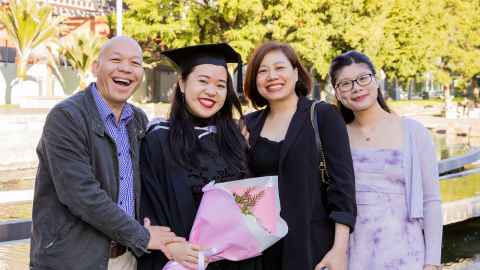 Anna and her family celebrate her achievements on graduation day at Spark Arena. Photo: Simon Young