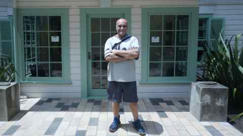 Carver Fred Harrison outside James Henare Research Centre before the carvings were returned to the whare. Photo: Rose Davis.