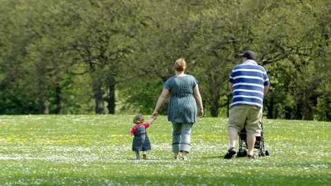 Big family walking in a park.