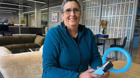 Sarah-Jane at Kitea offices holding the wand