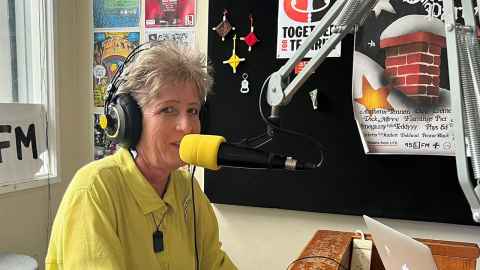 Nikki with headphones and mic in bFM studio