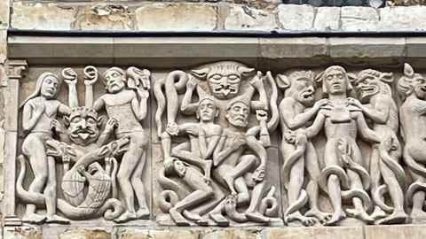 A frieze on the exterior of Lincoln Cathedral in the UK depicts so called 'sinners' getting their genitals eaten off by snakes. Photo: Nicholas Ringwood