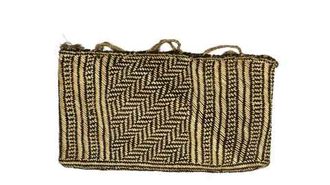 Kete whakairo, plaited from strips of flax. 
