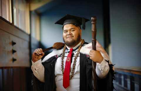 Taliaoa Aidan Samasoni-Tukuitonga inside the Auckland Law Library.