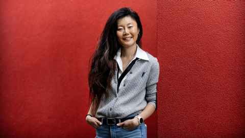 Sophie Jing standing in front of a red wall