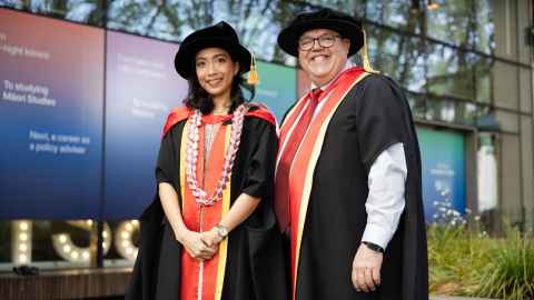 Annisa Hasanah and Theuns Henning in their graduation garments.