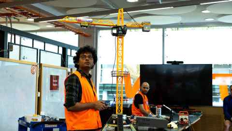 A giant crane with a broken motor was successfully fixed at the 2026 Repair Cafe. Photo: William Chea