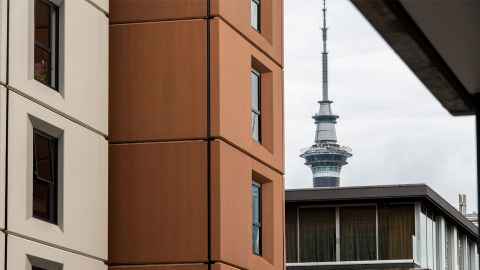 View of the top of the Sky Tower between Carlaw Park - Nicholls buildings 