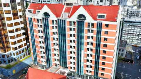 View of the top of the Sky Tower between Carlaw Park - Nicholls buildings 