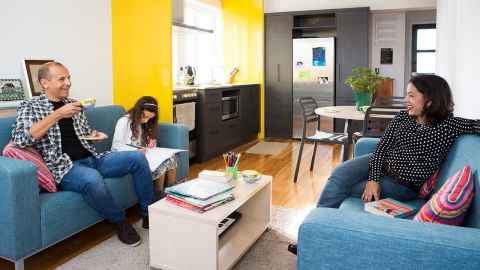 A family of mum, dad and a child in student accommodation