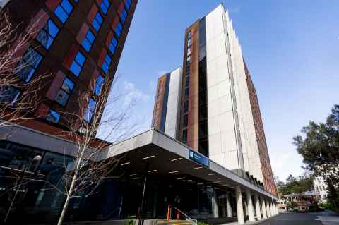 Exterior view of Waipārūrū Hall. Ground perspective looking up at the two towers. 
