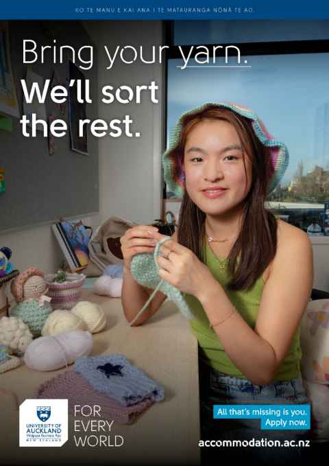 Victoria is sitting at her desk crocheting surrounded by her many creations while smiling at the camera. Text reads "Bring you yarn. We'll sort the rest. All that's missing is you. Apply now."