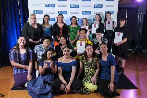 Group of residents posing for the camera with the Inclusion Awards certificate they just won.