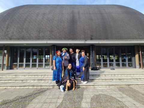 Six members of the Study Fono team pose in front of the University Fale Pasifika