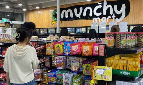 Inside Munchy Mart with snacks lined up on shelves