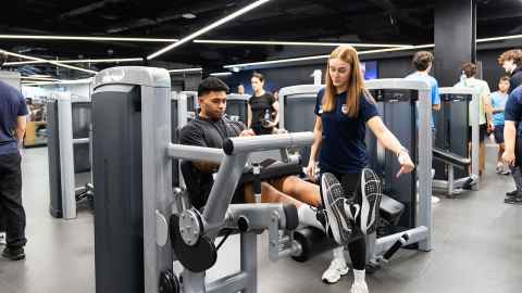 member working with a fitness instructor