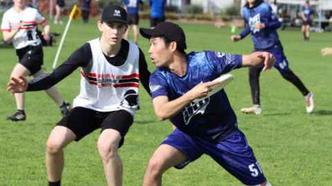 students playing tertiary ultimate frisbee