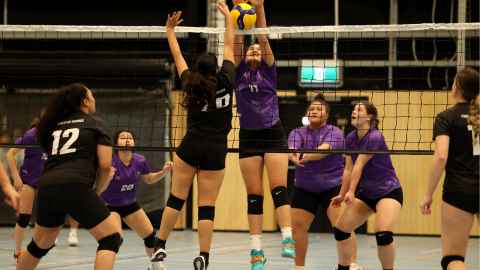 students playing interfaculty volleyball