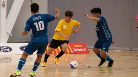students playing futsal