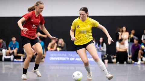 Students playing interfaculty futsal.=