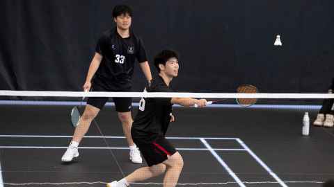 student playing badminton
