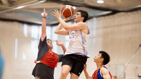 students playing basketball
