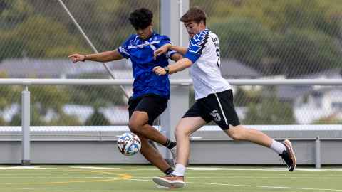 students playing football