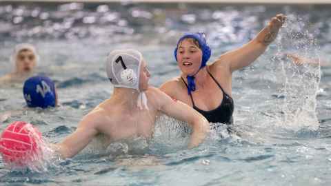 Two students playing water polo
