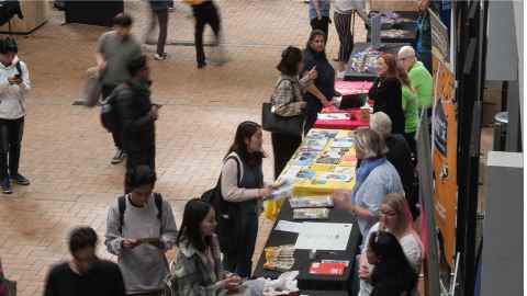 Students attending the volunteer expo in the student quad