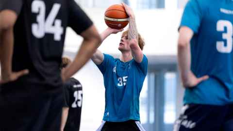 students playing interfaculty basketball