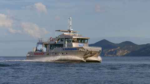 The Te Kaihopara Research vessel on the water.