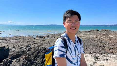 Martin Cheng conducting research at the beach