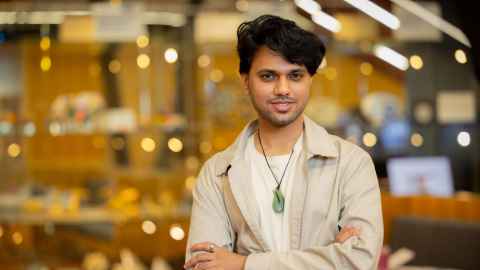 Master of Professional Studies in Data Science graduate Akash Ravi wearing a pounamu.