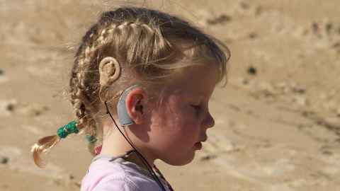 Child wearing cochlear implant, Flickr, Matt Ralph