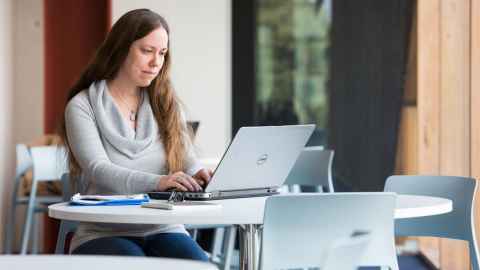 PhD student at a desk