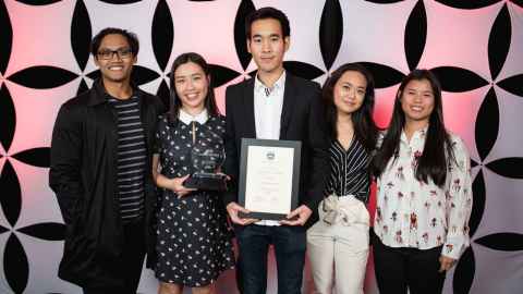 The University of Auckland's Comp Sci Society's five members posing for a photo with a certificate, 