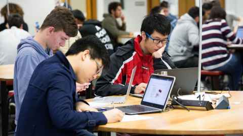 Members of the Physics Club in the Science faculty at the University of Auckland, working on a project together.