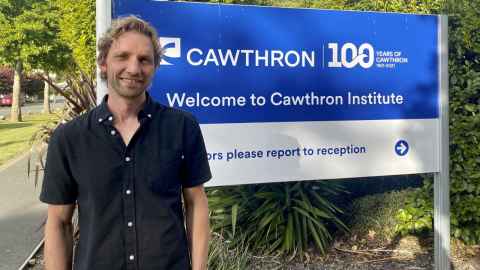 olivier laroche standing in front of cawthron institute sign