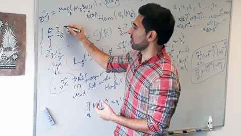 An image of Dr Pedram Hekmati working on a whiteboard