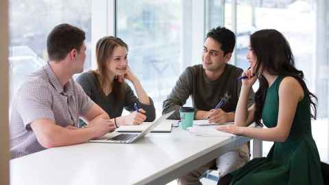 Group of four students in discussion