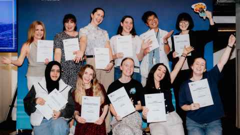 Doctoral candidates celebrating after winning prizes at the University of Auckland's annual SGS Research Showcase.