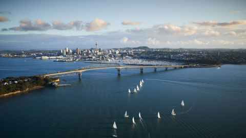 An aerial view of Auckland, including the famous Auckland Harbour Bridge.
