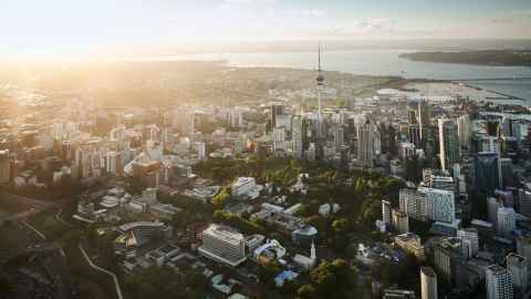 A beautiful aerial view of the University of Auckland and the Auckland skyline.