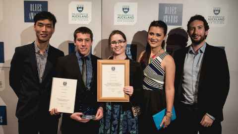 students posing with their blues awards