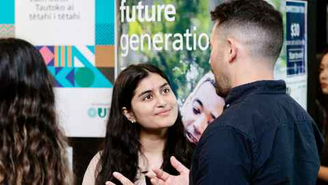 Student talking to a representative from a company at Career Bites.