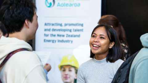 A student talking to an employer representative at a STEM expo