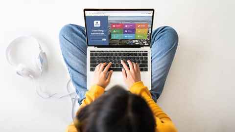 student working alone at laptop